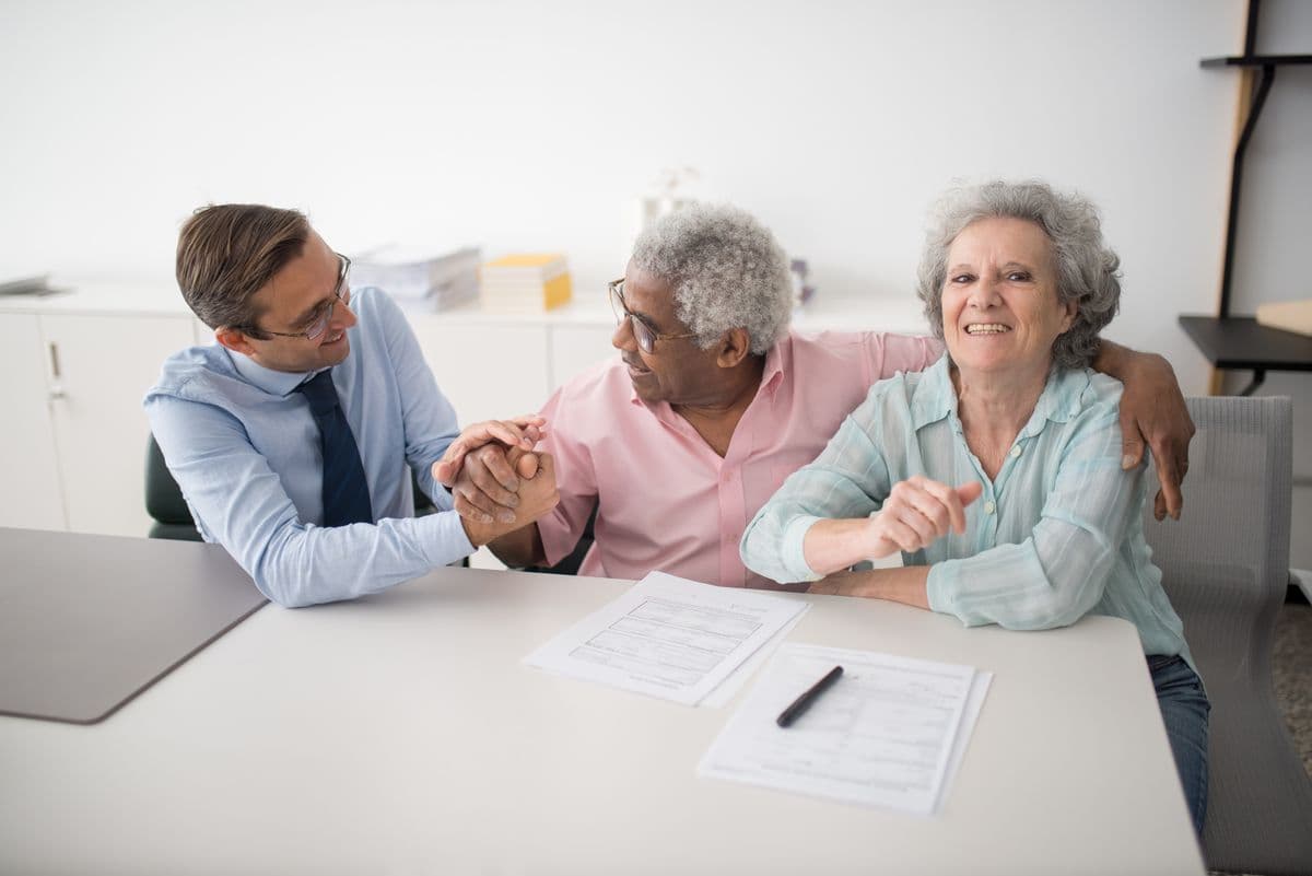 Licensed Florida insurance agents helping a couple compare plan options